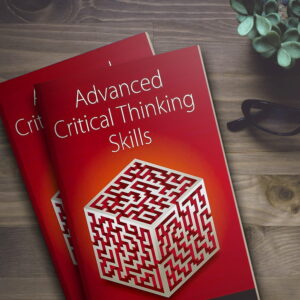 Book titled "Advanced Critical Thinking Skills" placed on a wooden desk with glasses and a plant nearby.