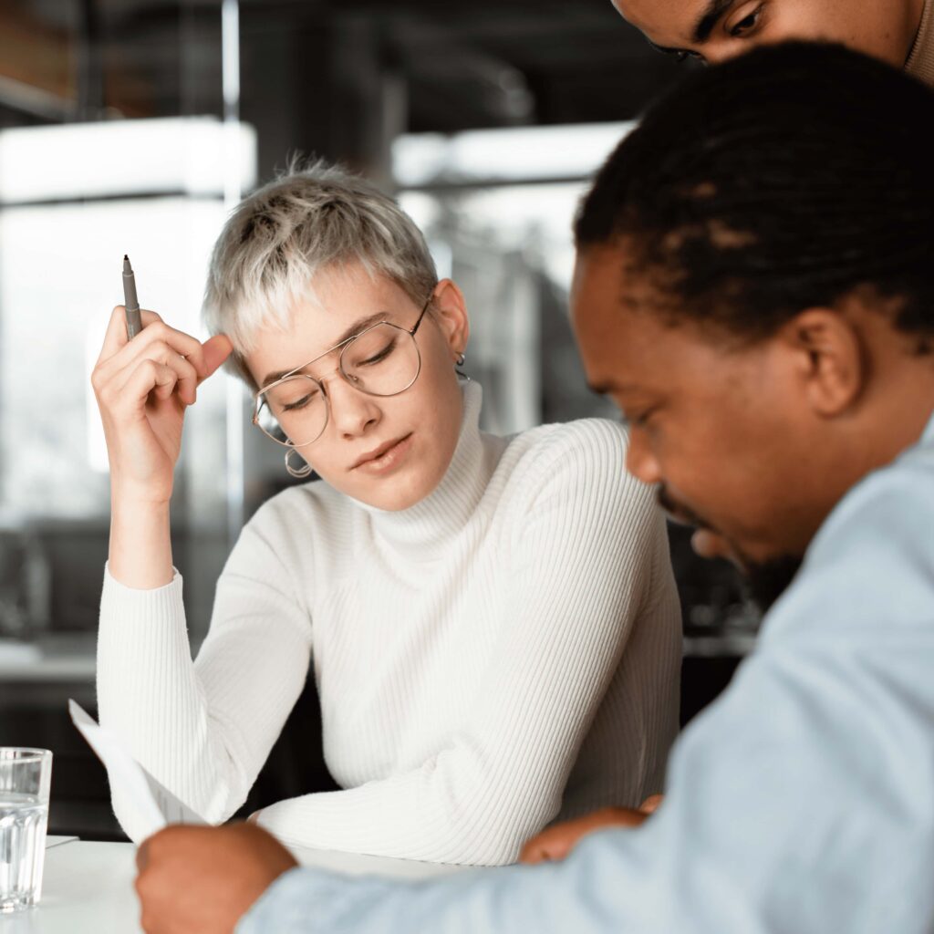People working together in a focused discussion during a critical thinking session.